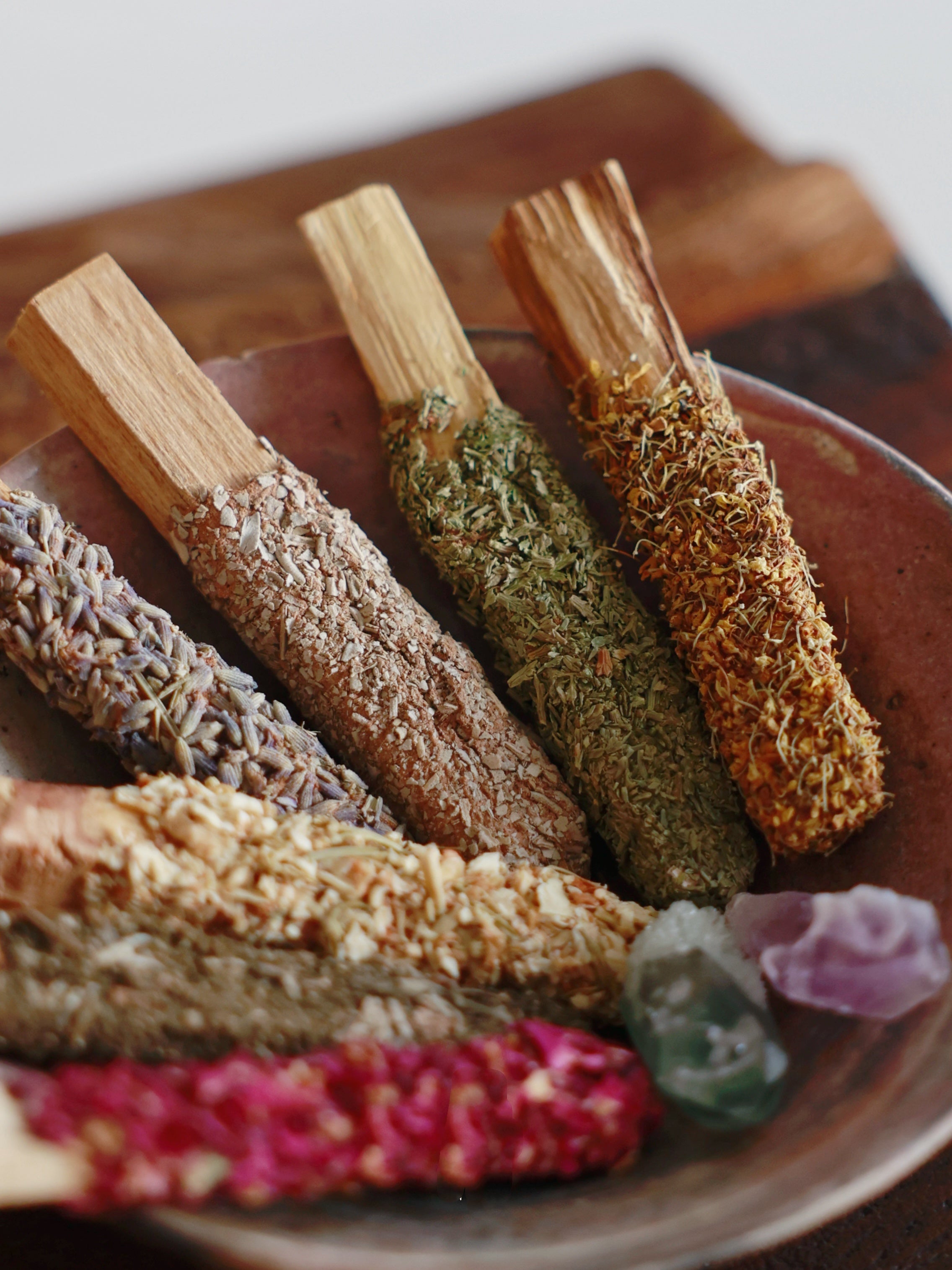 Close-up of customizable Floral Palo Santo sticks showing various dried botanicals for a unique sleep gift