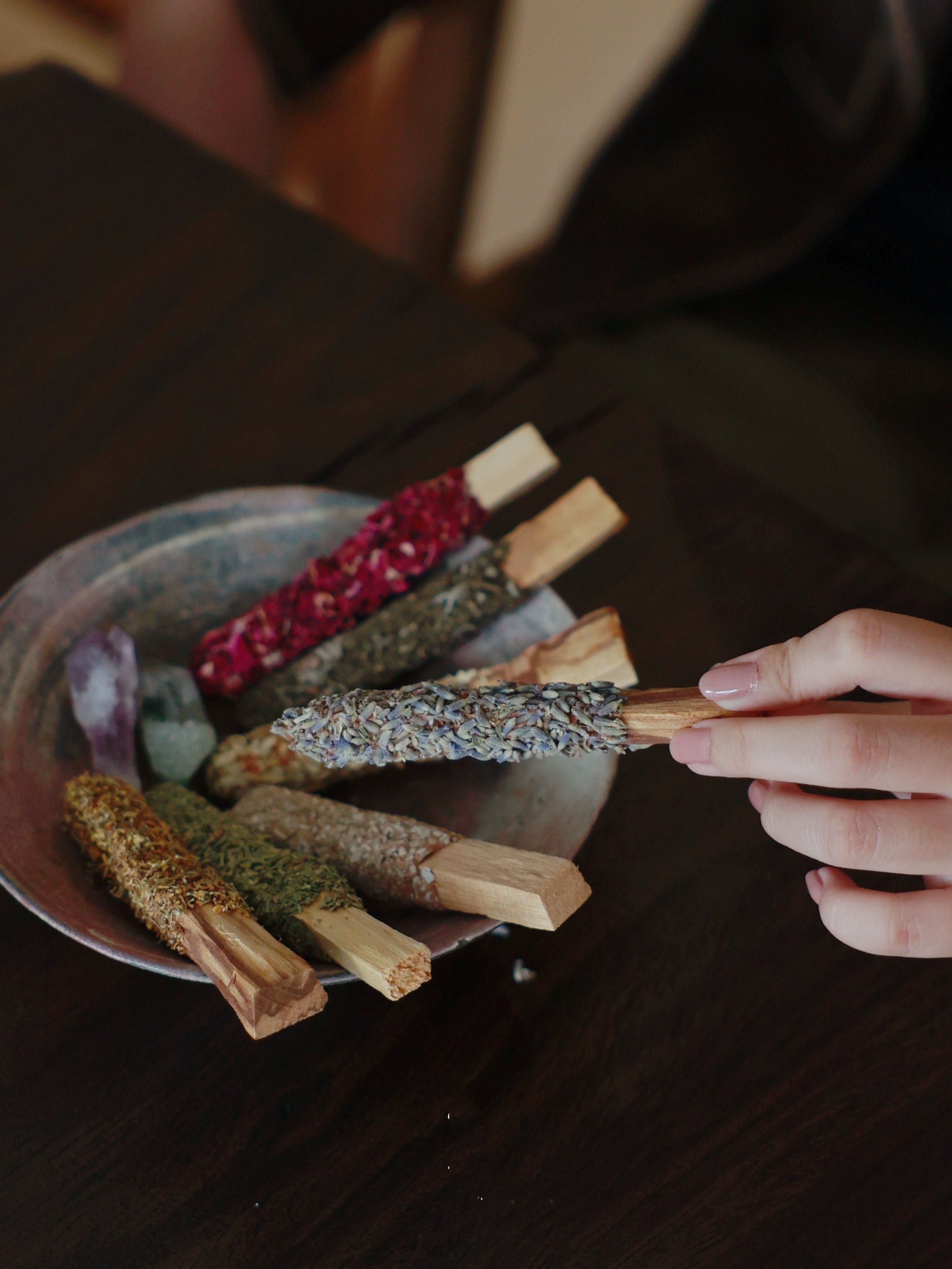 Close-up of customizable Floral Palo Santo sticks showing various dried botanicals for a unique sleep gift